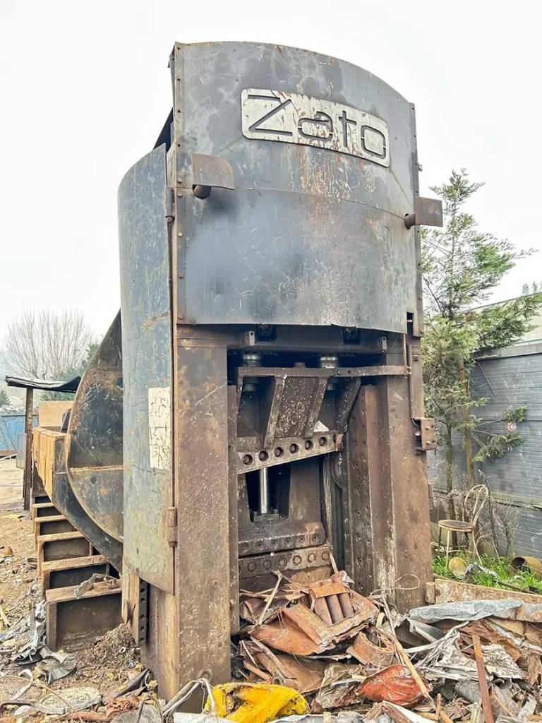 Used Zato Blue Whale scrap shear press front view with metal scrap cutting chamber.